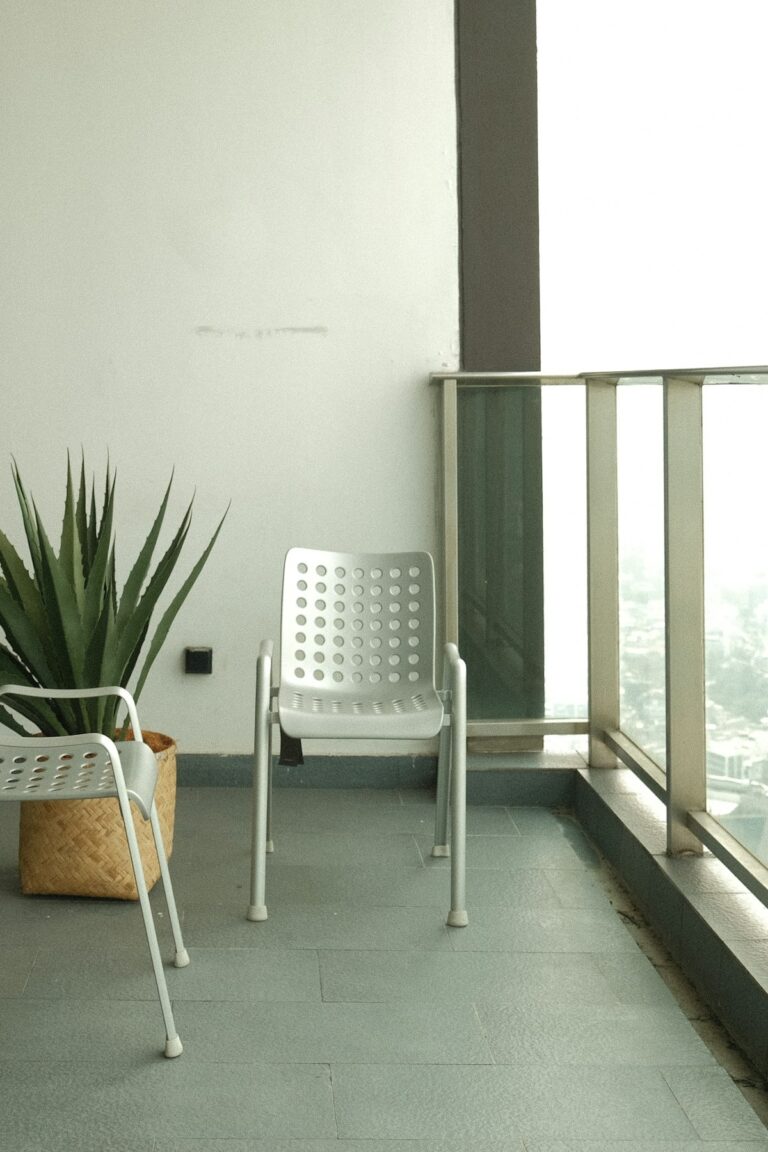 Balcony Privacy Tips: 17 Smart Ideas You'll Love 40 Balcony privacy tips with woven railing screen, tall planters, and sheltered outdoor seating on an apartment balcony
