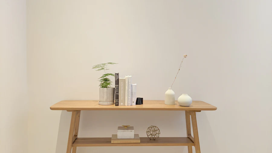 Work With Us & Media Kit | The Decor Nook Partnerships 2 Wood console styled with books, plant and ceramic vases in a minimal interior