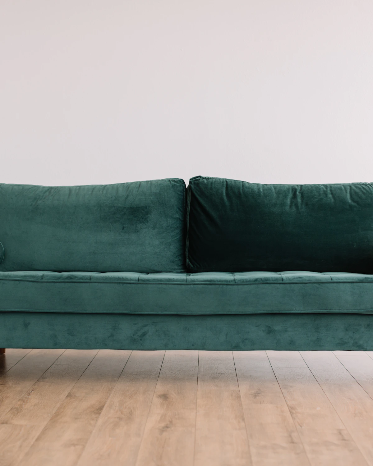 Make Living Room Look Bigger: 21 Best Small Apartment Design Tricks 6 Low-profile seating raised on visible legs and clear glass table to reduce visual bulk and make living room look bigger