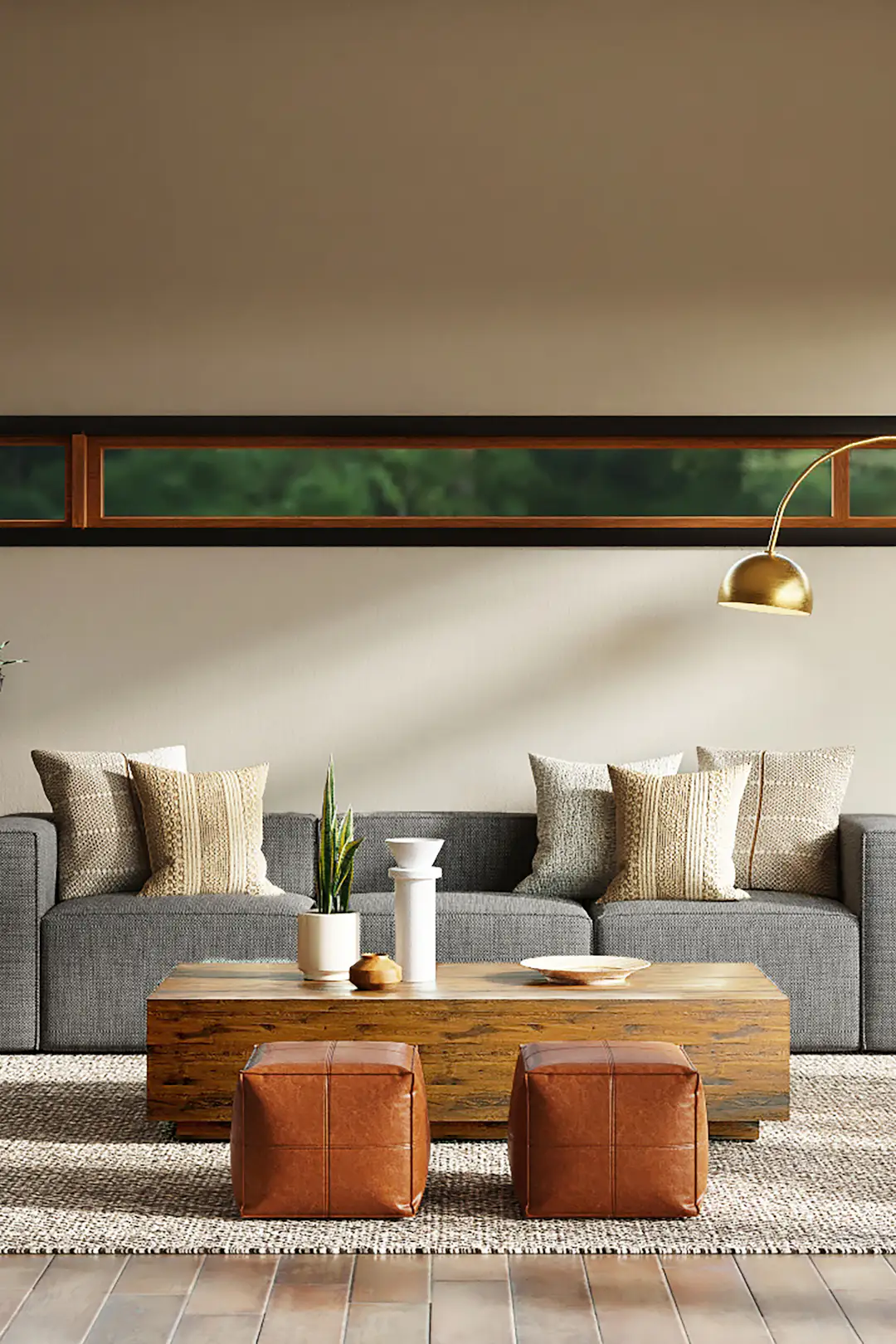 Make Living Room Look Bigger: 21 Best Small Apartment Design Tricks 2 Small apartment living room styled to look bigger with an airy low-profile beige sofa, round coffee table, and large cream rug